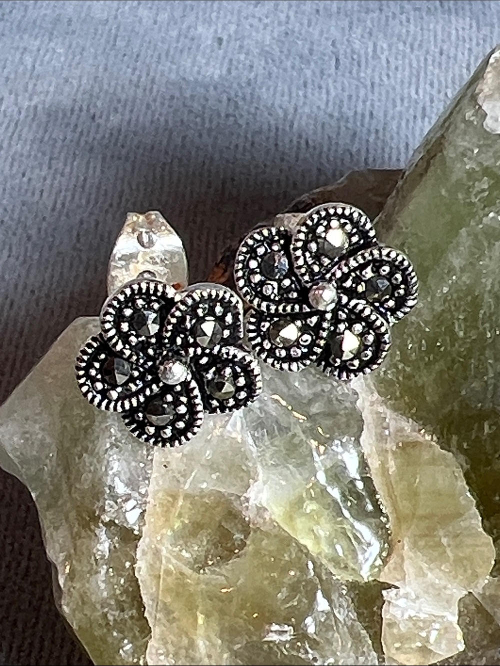 Sterling silver, flower shaped post / stud earrings with marcasite gemstones